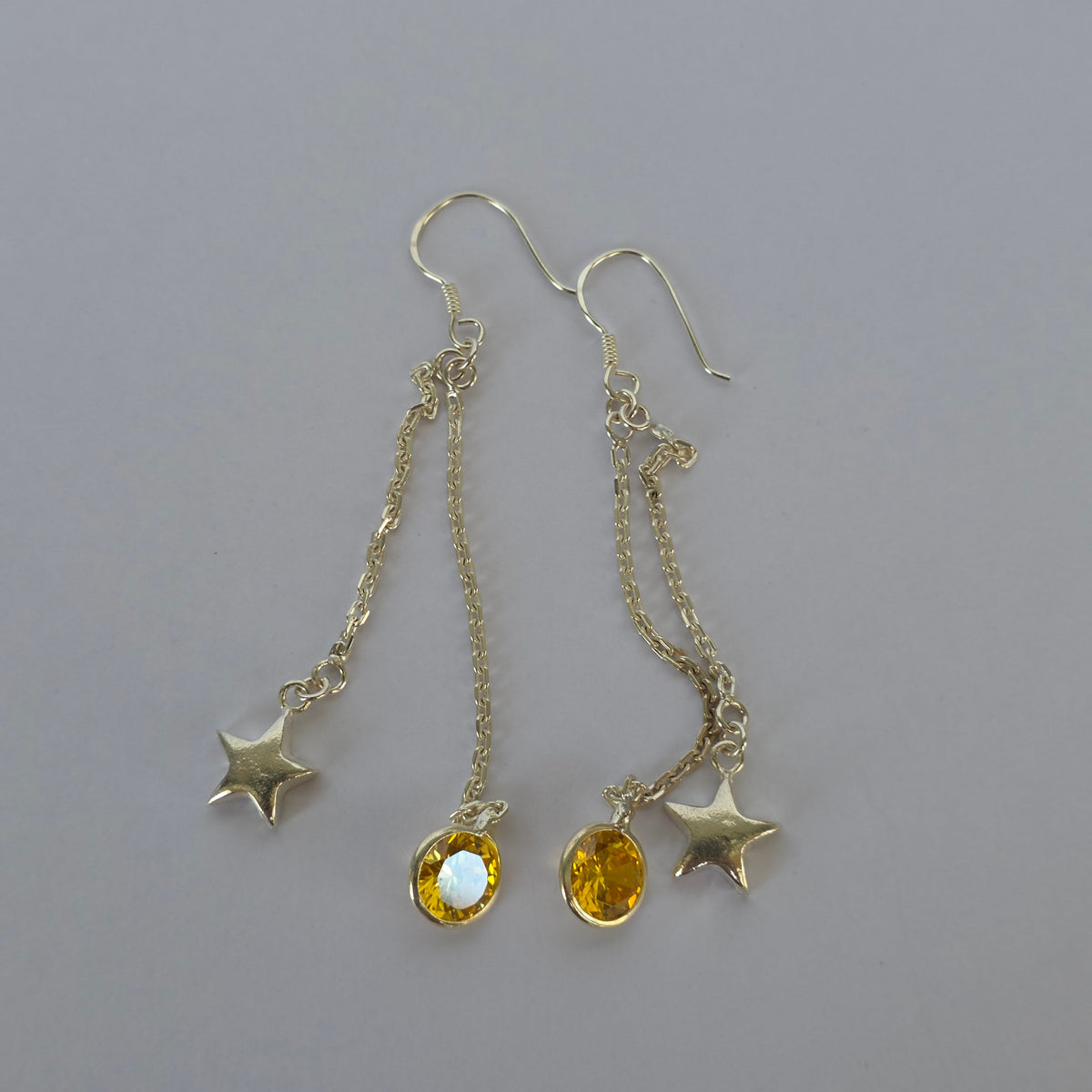 Aros Colgantes Estrellas con Microcircón Amarillo en Plata 925