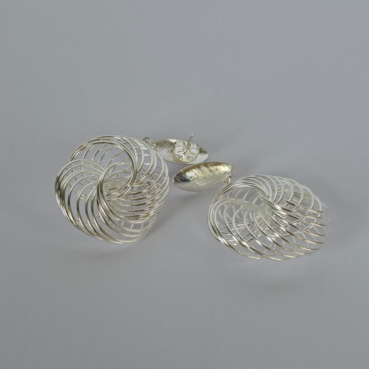 Aros Colgantes Espiral Entrelazada en Plata 925