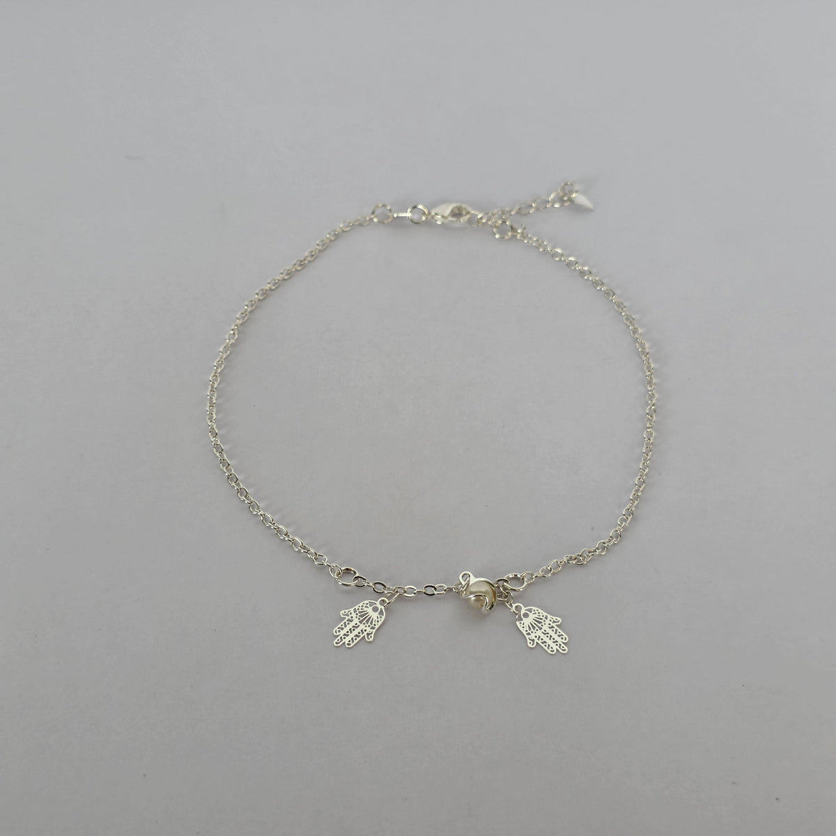 Tobillera Manos de Fátima Caladas con Delfín en Plata 925